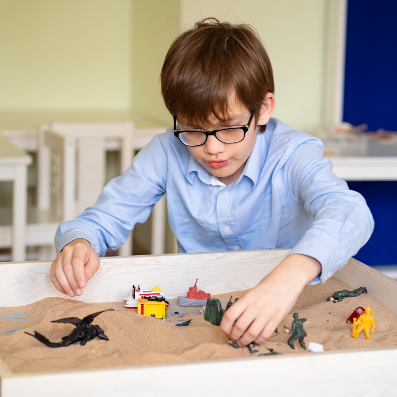 Child Playing in Sand